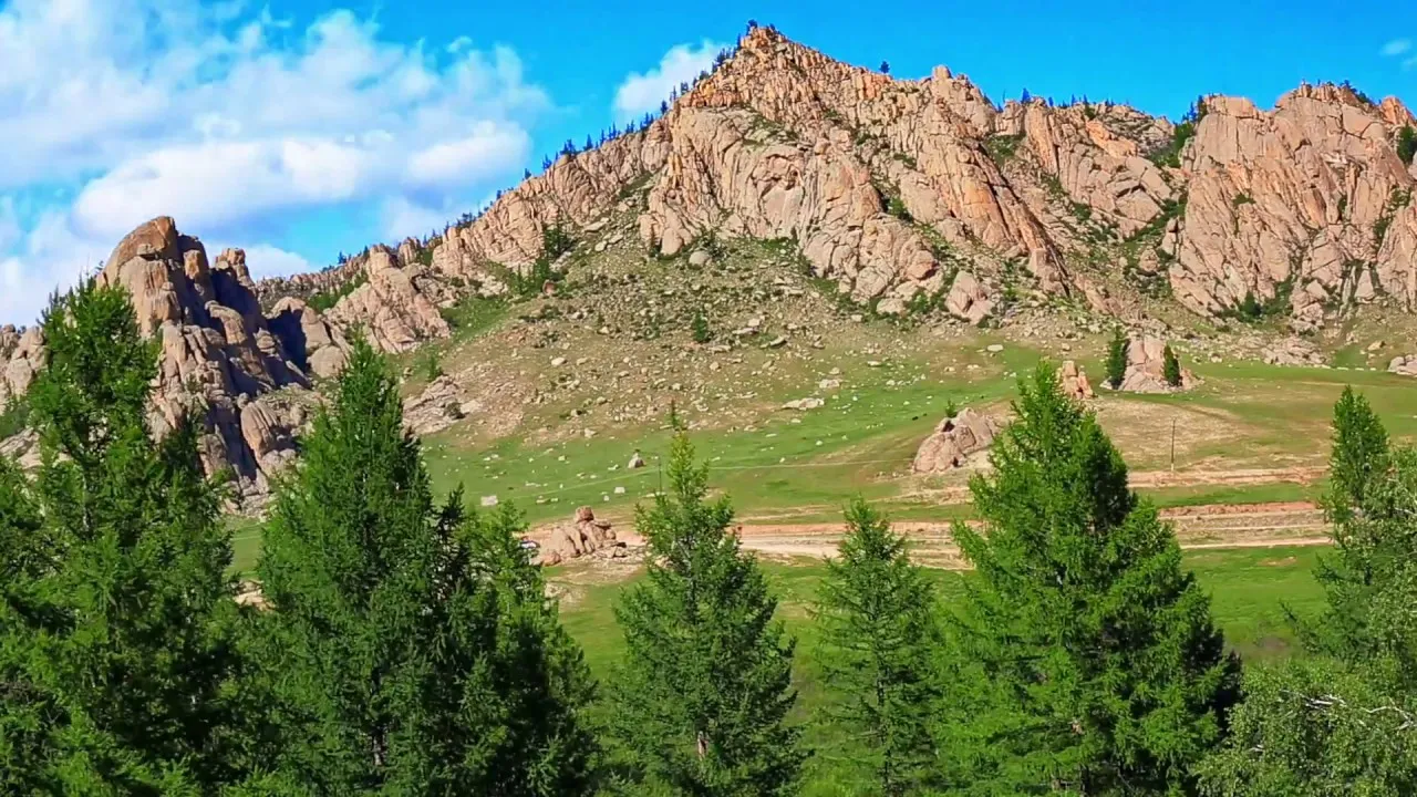 Sunlit ridges and valleys in Mongolia's Khentii Mountains